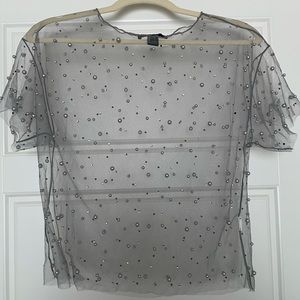 Sheer top with accent beading